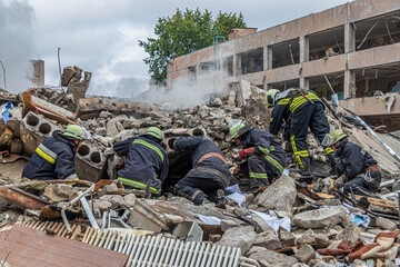 Rescue workers clearing debris after structural collapse