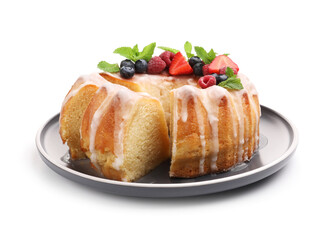 Pieces of delicious bundt cake with berries, glaze and mint isolated on white