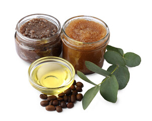 Natural body scrubs in glass jars, coffee beans, oil and eucalyptus branch isolated on white