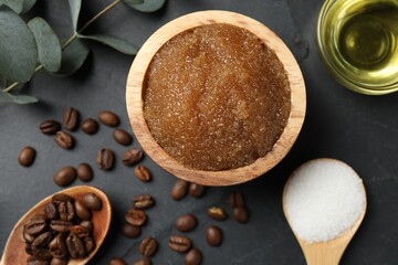 Natural body scrub and ingredients on black table, flat lay