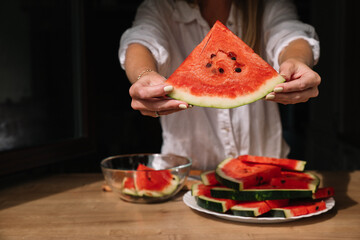 Slicing and serving fresh watermelon in a cozy kitchen setting during a summer afternoon