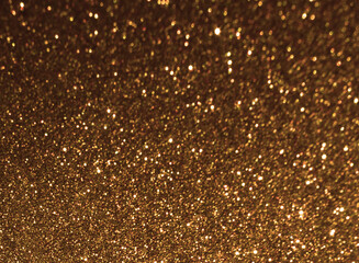 Golden brown bokeh background. New Year, Christmas and all celebration background concept.