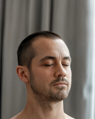 Man serious contemplative portrait beard masculine close-up professional studio headshot