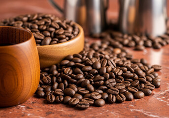 Roasted coffee beans spread across a surface, highlighting rich brown tones, texture, and aroma in a detailed macro shot.