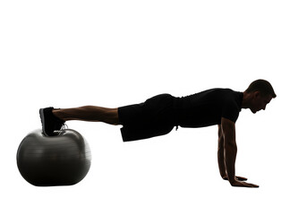 Man performing plank exercise on stability ball in fitness studio  isolate