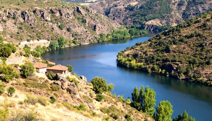 Fototapeta premium Scenic river valley with houses nestled in the hills