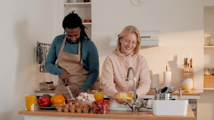Happy couple preparing ingredients for a meal - Powered by Adobe