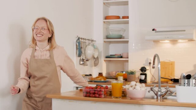 Couple cooking and working from home in kitchen - Powered by Adobe