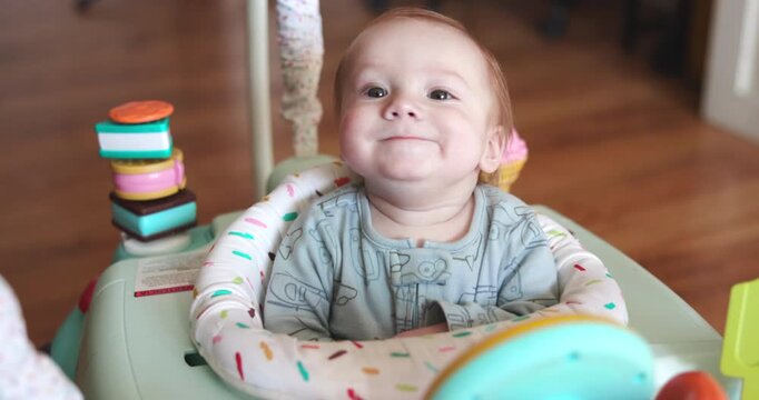 Happy Baby In Bouncer