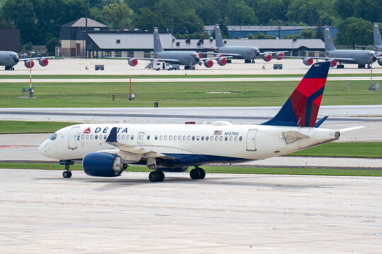 Milwaukee, WI, USA - August 13, 2025: Delta Airlines Airbus A220 taxies on the runway at Milwaukee General Mitchell International Airport.  