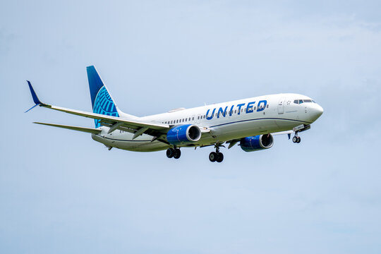 Milwaukee, WI, USA - August 13, 2025: United Airlines Boeing 737 prepares for landing at Milwaukee General Mitchell International Airport.  