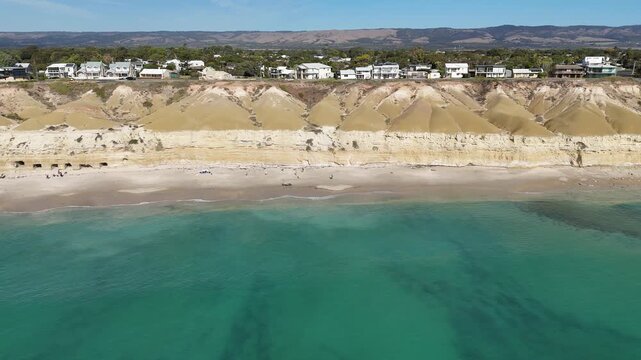 Port Willunga Beach, South Australia &ndash; 4K Aerial Drone Footage of Australia Beach, Historic Jetty Ruins, Limestone Cliffs, Golden Sand, Clear Blue Ocean Coastline, and Coastal Houses
