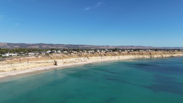 Port Willunga Beach, South Australia &ndash; 4K Aerial Drone Footage of Australia Beach, Historic Jetty Ruins, Limestone Cliffs, Golden Sand, Clear Blue Ocean Coastline, and Coastal Houses