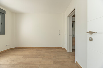 Natural wood flooring in an empty room, where each plank tells a story of rusticity and authenticity