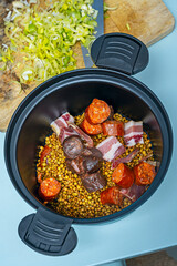 Lentil dish with extra-juicy chorizo and crispy bacon, garnished with chopped hard-boiled egg for contrast
