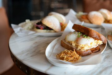 Assorted sandwiches served on a cozy cafe table
