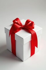 Fototapeta premium Elegant white gift box, tied with a vibrant red ribbon , background, color, anniversary