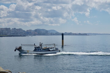 Trawler Passing Jeju Waterfront © koreabybike