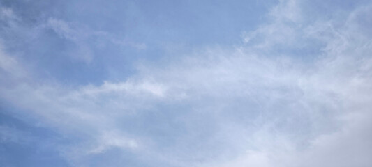 Background with clouds on blue sky. Sky view. Beautiful sunny sky.