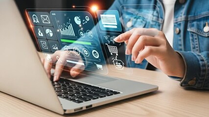Woman typing on laptop with digital interface showing charts and e commerce icons overlaying screen - Powered by Adobe