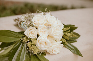 wedding bouquet on the table with wedding rings