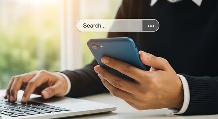 Business man using laptop and mobile phone for searching information online
