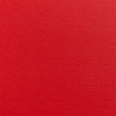 A close-up shot of a textured, solid red surface