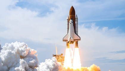 Space Shuttle Launching Into Blue Sky with Intense Smoke and Fire Emerging from Engines