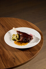 Enjoy a Gourmet Lamb Dish that comes beautifully presented with Brussels Sprouts and Sauce