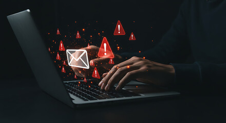 Hands typing on a laptop with glowing red digital icons representing cyber threats and data security