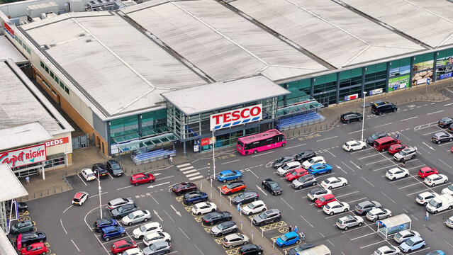 Aerial photo of Tesco Superstore, Carpetright, Curry&rsquo;s and Trade Point in Newtownabbey Antrim Northern Ireland 08-08-25