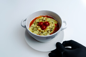 Gourmet 'Quesaña,' a creative no-pasta lasagna made with layers of melted cheese instead of pasta, a healthy low-carb and keto-friendly baked dish with tomato sauce, isolated on a white background