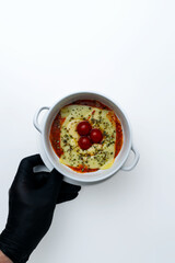Gourmet 'Quesaña,' a creative no-pasta lasagna made with layers of melted cheese instead of pasta, a healthy low-carb and keto-friendly baked dish with tomato sauce, isolated on a white background