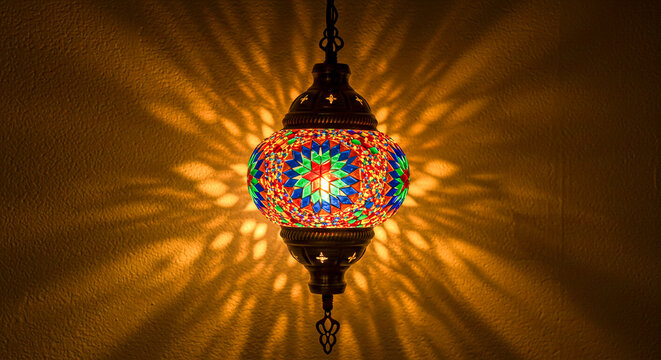 urkish mosaic lamp illuminating intricate patterns on wall