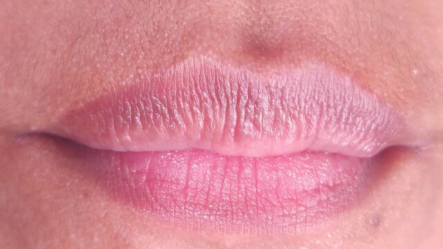 Close up Macro of Indian teenage girl lips doing various types of expressions.