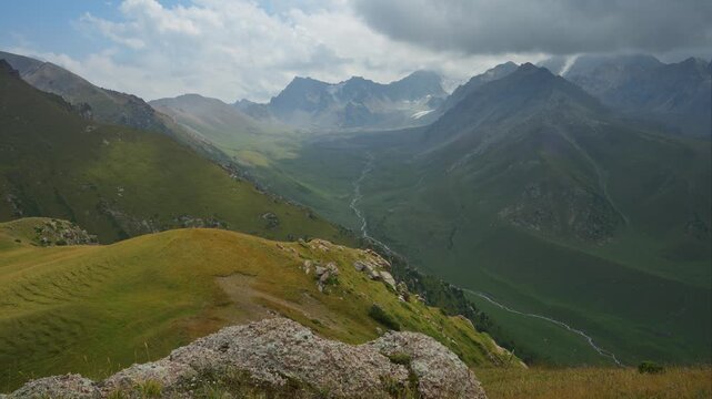 Timelapse of Kashka Suu river valley captured from a mountain peak in August.