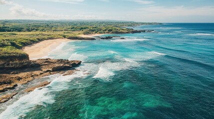 Obraz premium A breathtaking aerial view of a coastal landscape with turquoise waters and rocky cliffs.