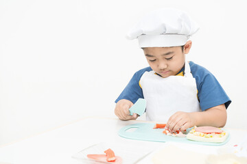 The boy is studying cooking.