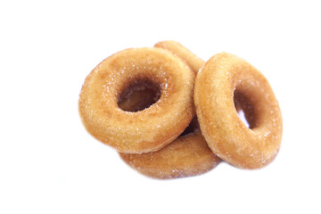 Homemade sugar milk donuts on white background, soft and fluffy texture, buttery aroma, fried snack. Delicious treat for eating or selling, concept of fried pastry and sweet dessert.            