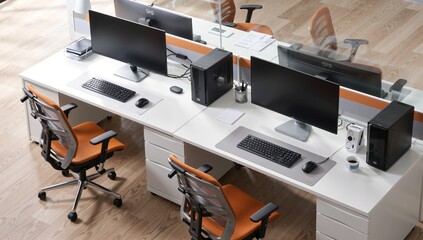 Modern office setup with dual workstations featuring ergonomic chairs and multiple computer monitors on white desks.
