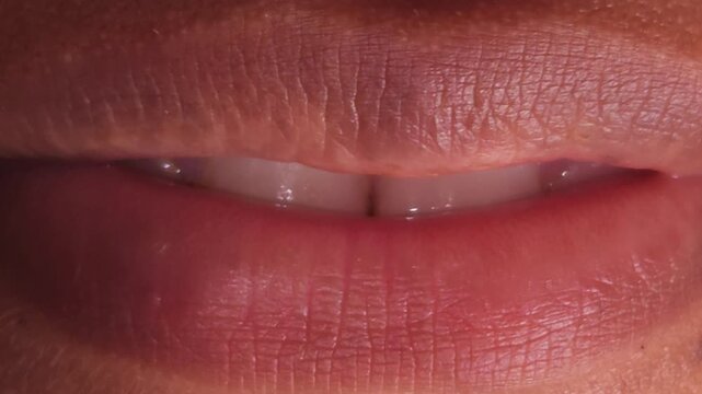 Close up Macro of Indian teenage girl lips doing various types of expressions. lift, Frown, grimace, moue, scowl, pout, Kiss, smooch, smack, peck, graze, caress, skim