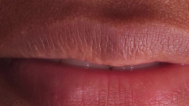 Close up Macro of Indian teenage girl lips doing various types of expressions. lift, Frown, grimace, moue, scowl, pout, Kiss, smooch, smack, peck, graze, caress, skim