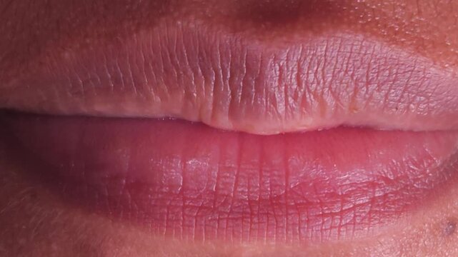 Close up Macro of Indian teenage girl lips doing various types of expressions. lift, Frown, grimace, moue, scowl, pout, Kiss, smooch, smack, peck, graze, caress, skim