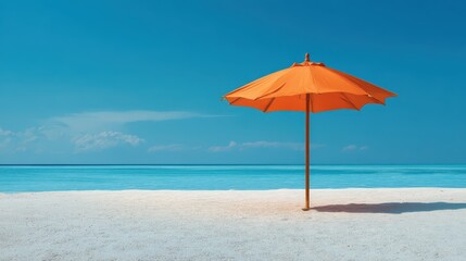 Summer travel planning concept shows Bright orange umbrella on a sandy beach with a serene blue ocean and sky backdrop.
