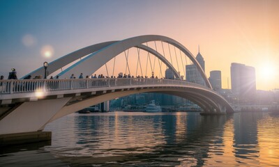 Obraz premium Modern arch bridge at sunset over city harbor. People walk