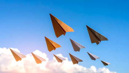 Group Of Paper Airplanes Soaring In Bright Blue Sky Among Wispy Clouds Representing Leadership And Forward Movement