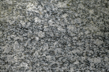 Facing material granite texture. Natural stone grey granite background texture. Bright hard grey granite rock texture. Grey granite stone background texture