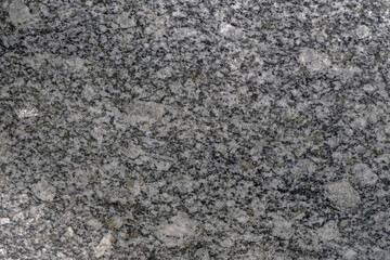 Facing material granite texture. Natural stone grey granite background texture. Bright hard grey granite rock texture. Grey granite stone background texture