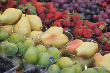 Colorful display of fruits at a market stall