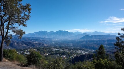 Panoramic view of the San Fernando Valley, California, with the Santa Monica Mountains in the distance and a clear blue sky above.